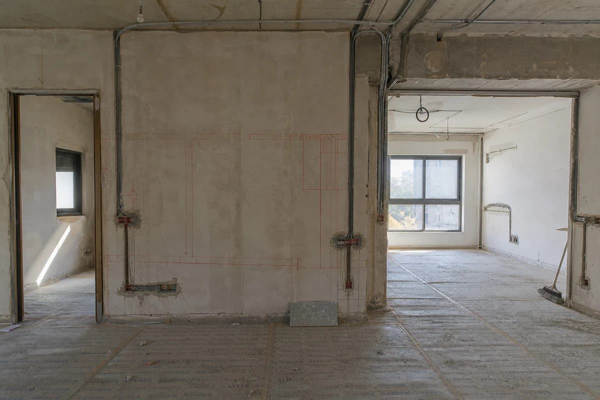 Unfinished Damascus interior with marked partition relocation that needs a priced construction change order