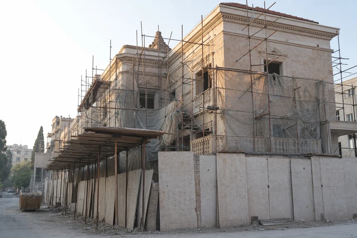 Damascus villa exterior under scaffolding during site supervision for construction change orders Syria