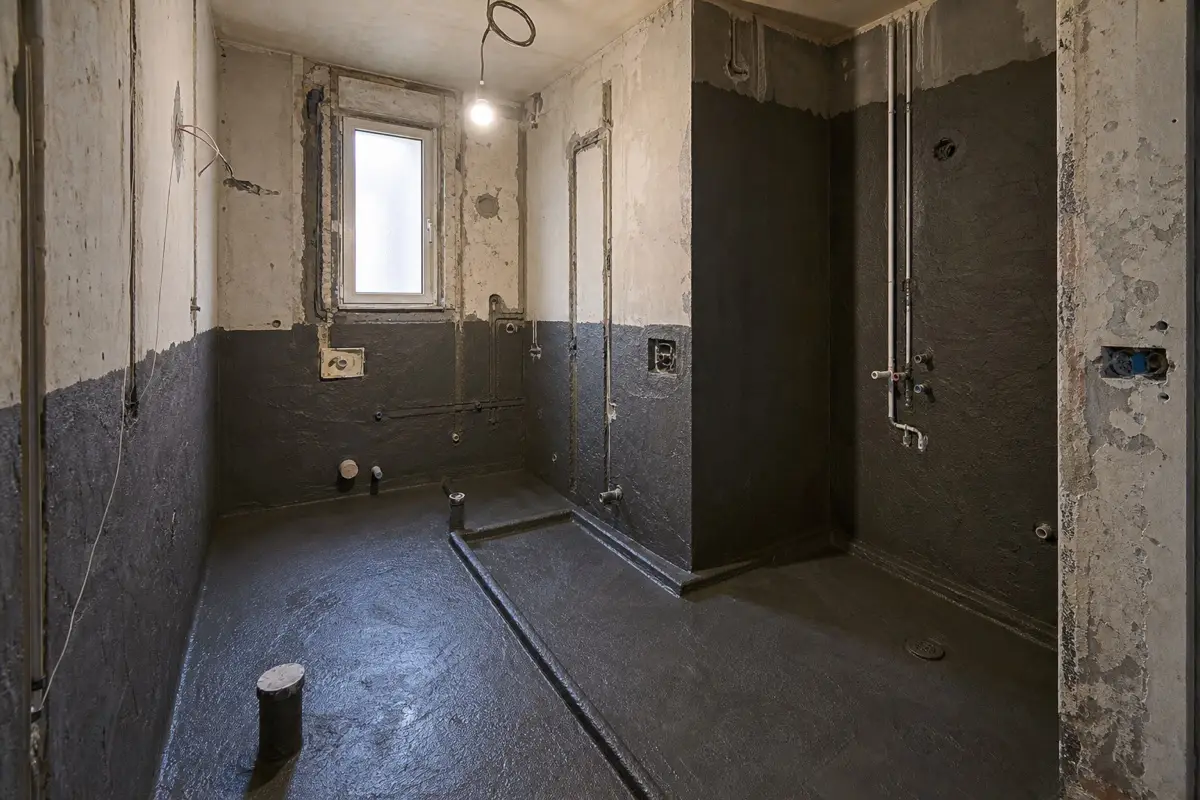 Older Damascus apartment bathroom with waterproofing applied before apartment finishing starts